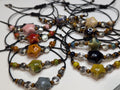 NoctemPottery Ceramic Star Spiral Beaded Bracelet 10in Black Cord