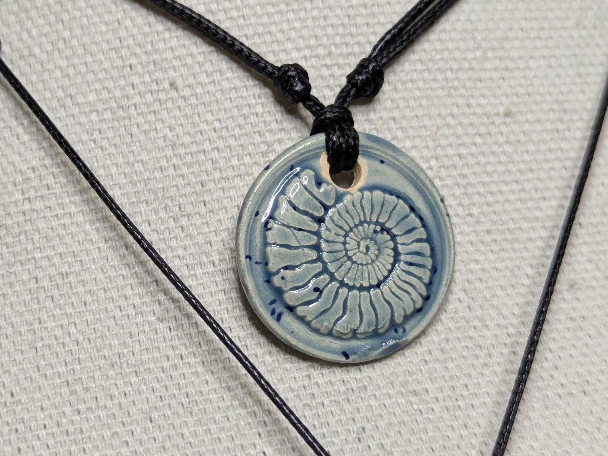 NoctemPottery Handmade Ceramic Ammonite Pendant Faux Wax Seal Necklace Black Cord