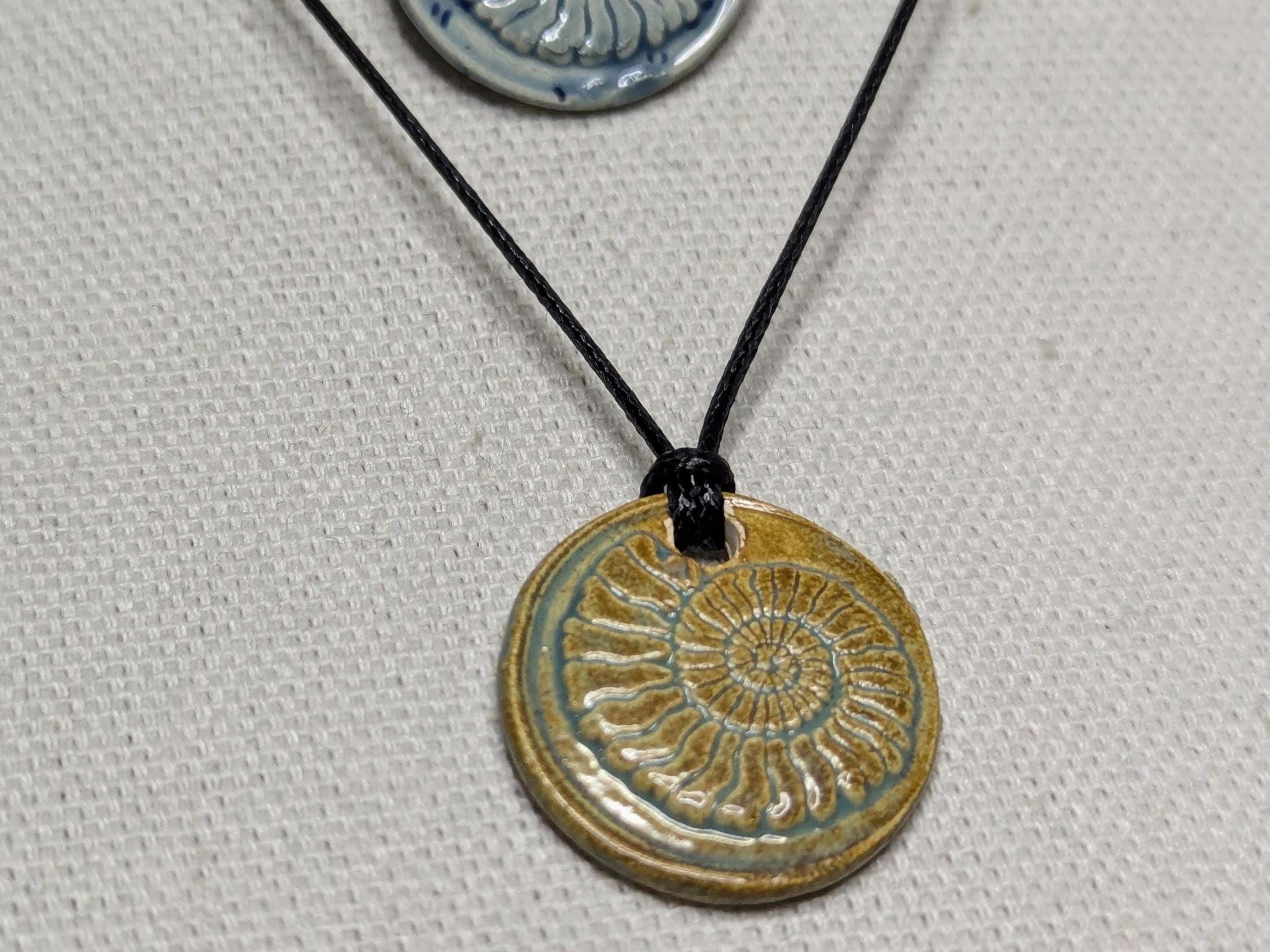 NoctemPottery Handmade Ceramic Ammonite Pendant Faux Wax Seal Necklace Black Cord